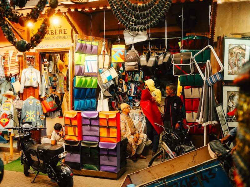 People riding horses through the streets of Marrakech, Morocco